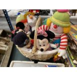 A WICKER BASKET CONTAINING VARIOUS SOFT TOYS