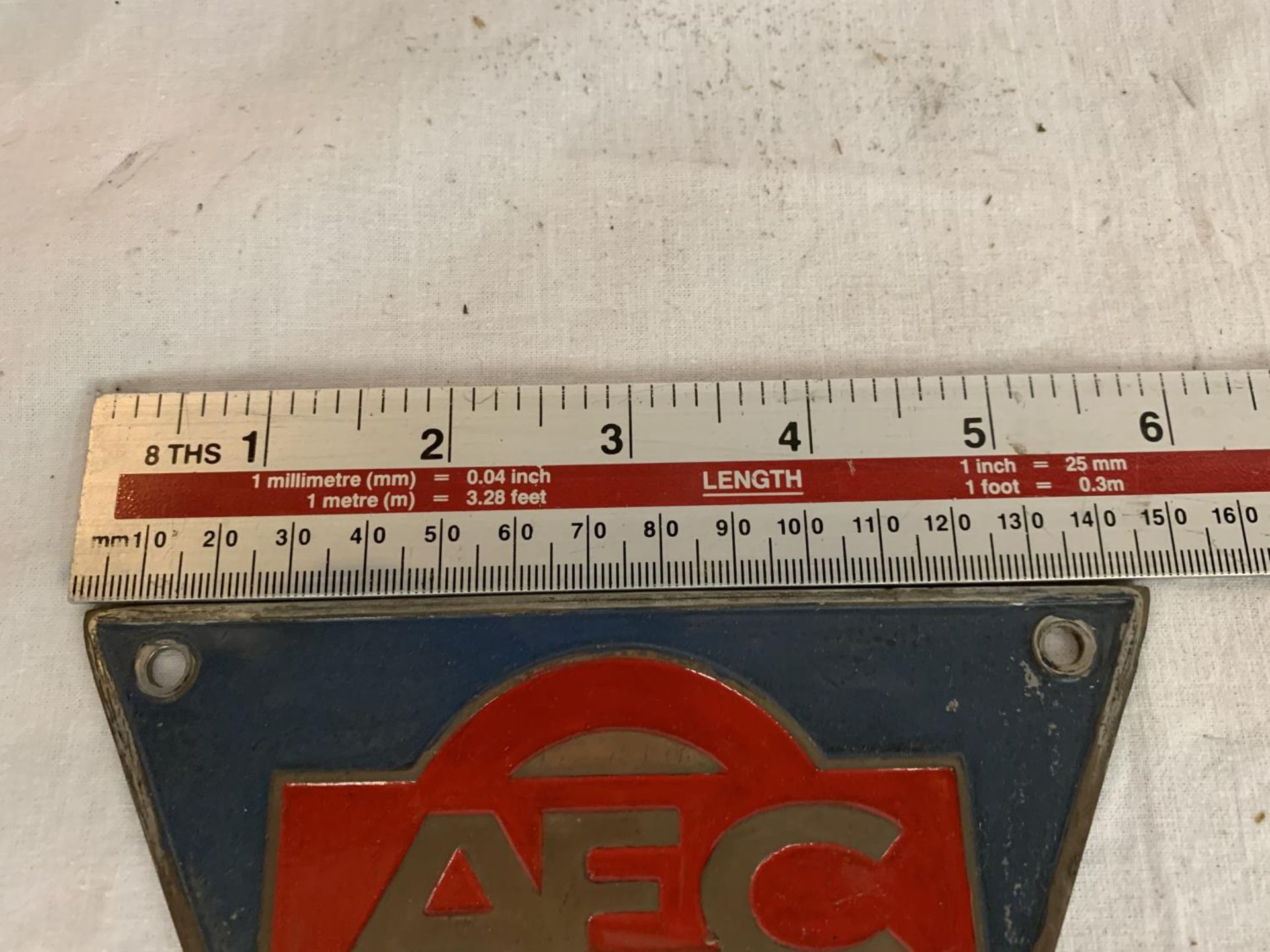 A VINTAGE CAST TRAINGULAR AEC SIGN 15CM ACROSS THE TOP - Image 2 of 3