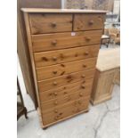 A TALL PINE CHEST OF TWO SHORT AND EIGHT LONG DRAWERS