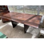 A MAHOGANY DINING TABLE