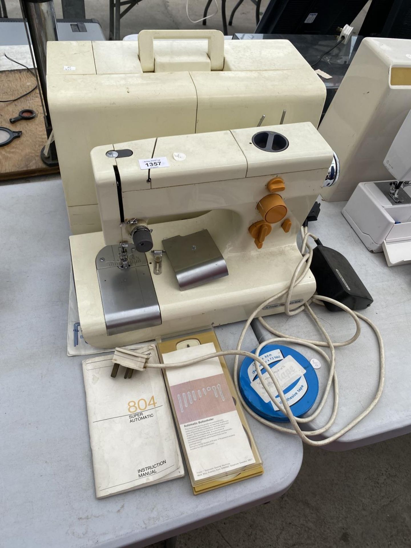 A CASED FRISTER ROSSMANN SEWING MACHINE WITH ACCESSORIES IN WORKING ORDER