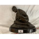 A BRONZE DISCREETLY NUDE FIGURE ON A MARBLE BASE