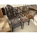 FOUR ELM SEATED WHEEL BACK DINING CHAIRS AND TWO CARVERS