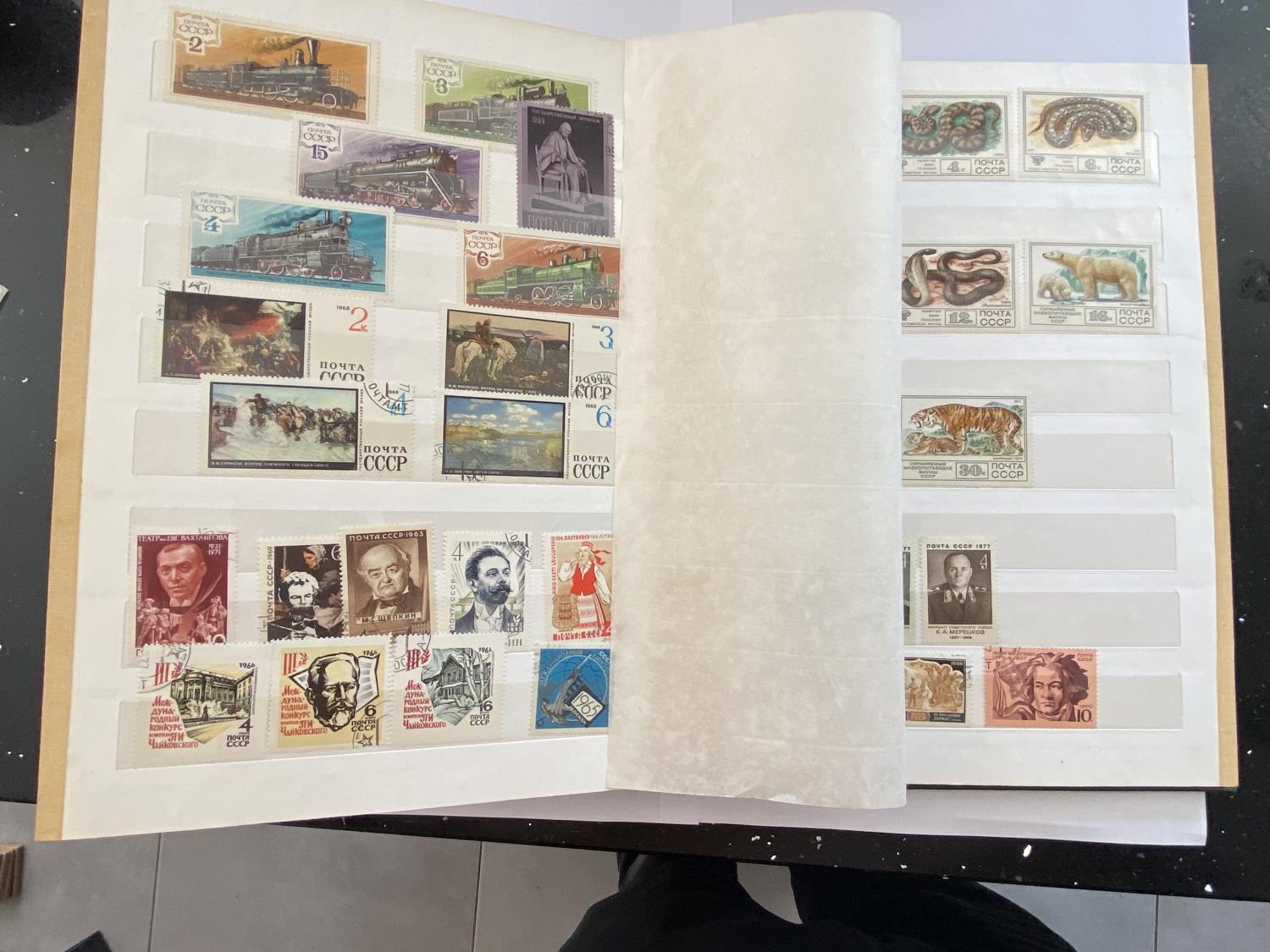A STAMP ALBUM CONTAINING RUSSIAN STAMPS
