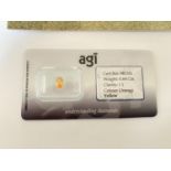 A 0.64 CARAT OVAL CUT YELLOW SAPPHIRE - CLARITY I1. WITH AGI CERTIFICATE OF AUTHENTICITY