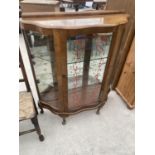 A WALNUT CHINA CABINET ON CABRIOLE SUPPORTS WITH SINGLE DOOR