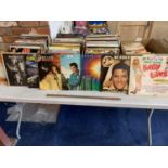 A LARGE QUANTITY OF LPS AND SINGLES TO INCLUDE ELVIS, EARTH WIND AND FIRE, AMERICAN CLASSICS ETC