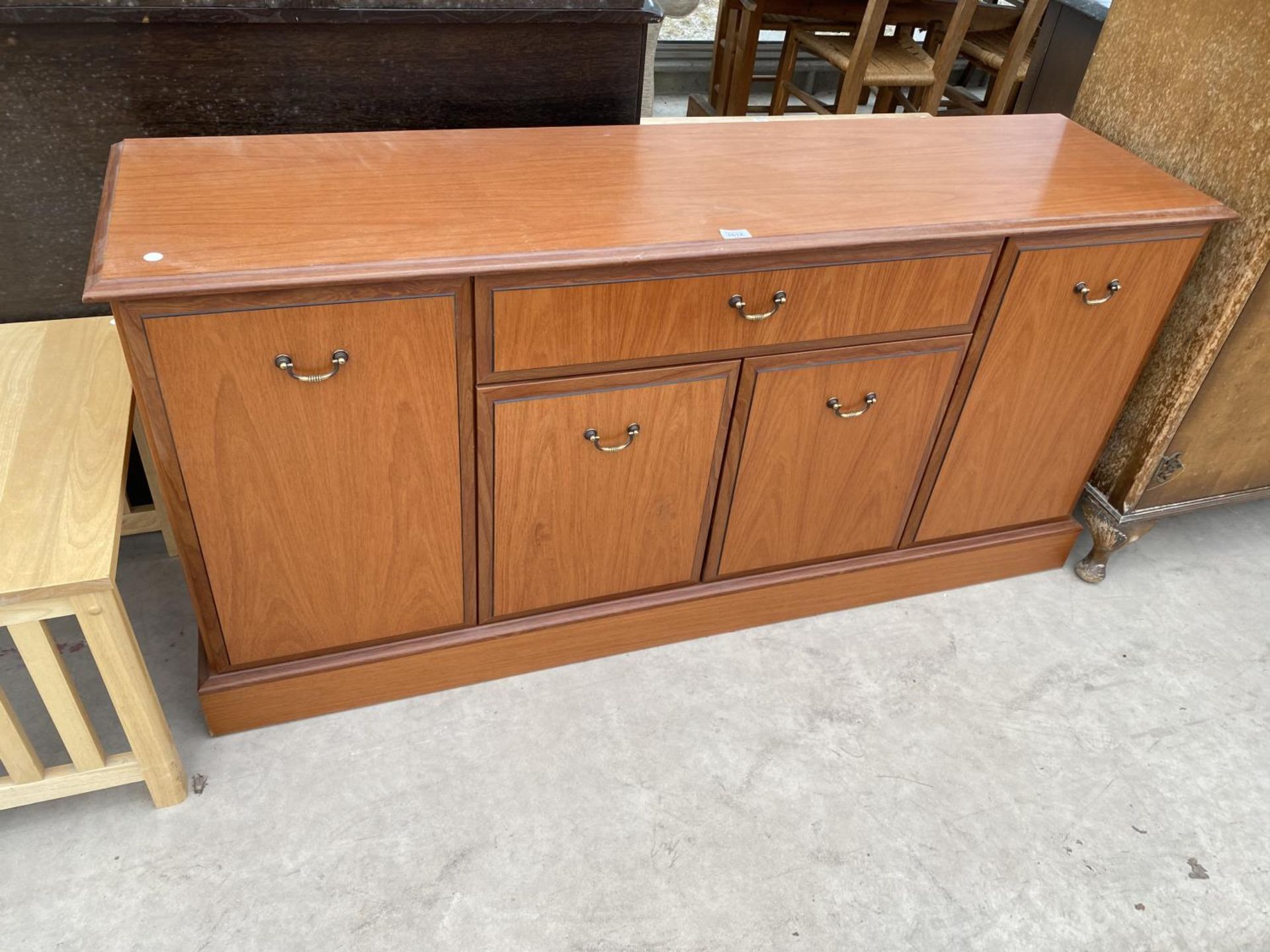 A MORRIS FURNITURE CHERRY WOOD SIDEBOARD WITH FOUR DOORS AND ONE DRAWER