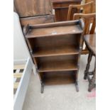 A SMALL OAK THREE TIER BOOKCASE