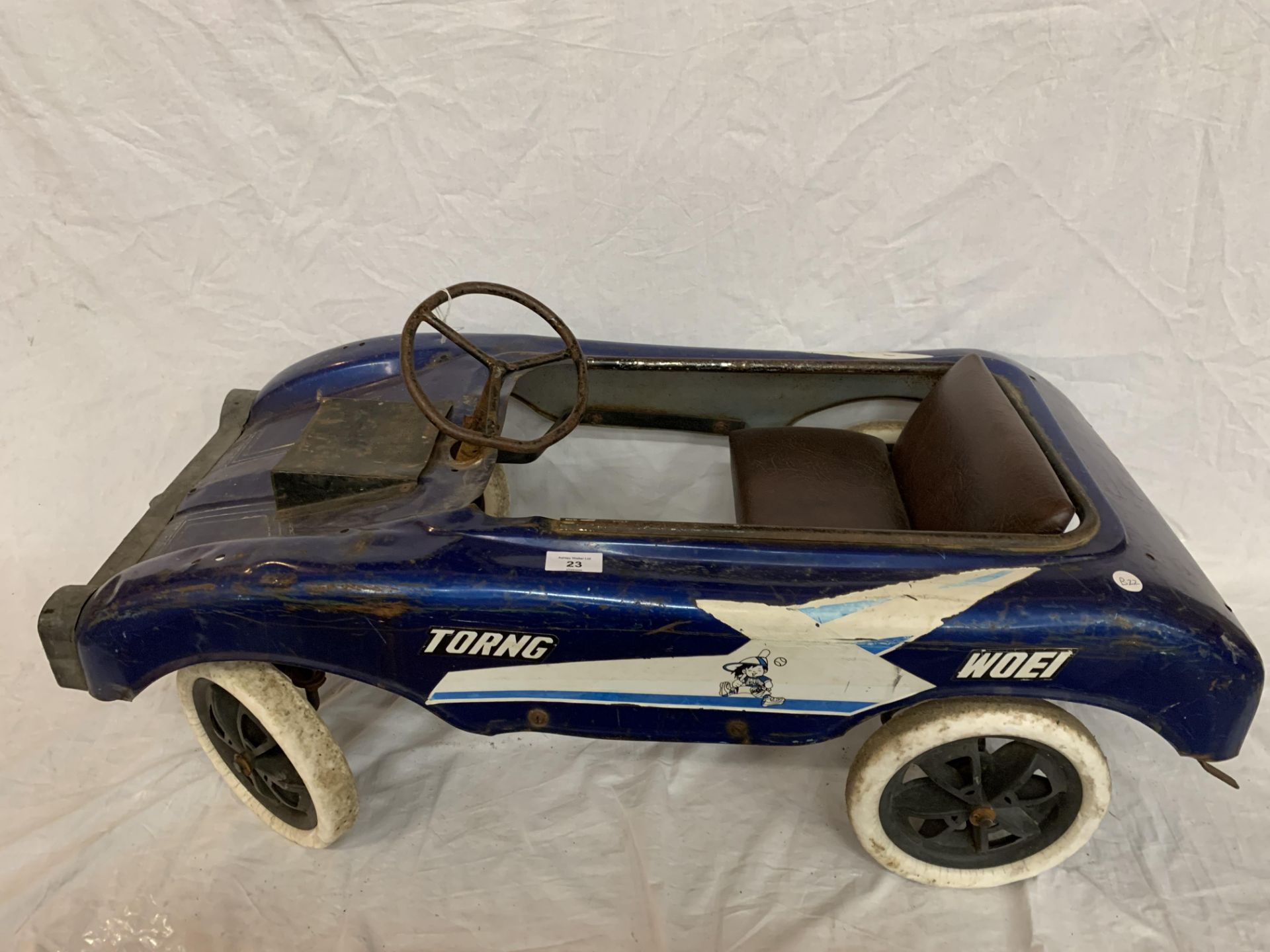 A VINTAGE TORING WOEI CHILDRENS PEDAL RACING CAR IN BLUE