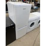 A BEKO FRIDGE FREEZER IN NEED OF CLEAN - IN WORKING ORDER