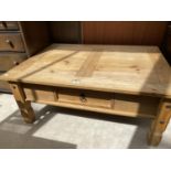 A MEXICAN PINE COFFEE TABLE WITH SINGLE DRAWER