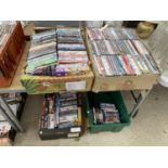 A LARGE QUANTITY OF DVDS, CDS AND VIDEOS