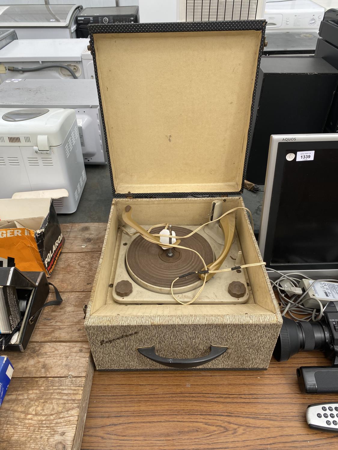 A CASED VINTAGE RECORD PLAYER