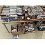 A LARGE QUANTITY OF DVDS, CDS AND VIDEOS