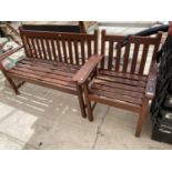 A WOODEN GARDEN BENCH WITH MATCHING CHAIR