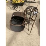 A VINTAGE CAST IRON TIVET AND COMPANION SET AND A COAL SCUTTLE