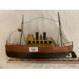 A VINTAGE TIN PLATE BOAT