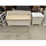 A WHITE BEDROOM SEAT WITH STORAGE COMPARTMENT AND A WHITE LINEN BOX