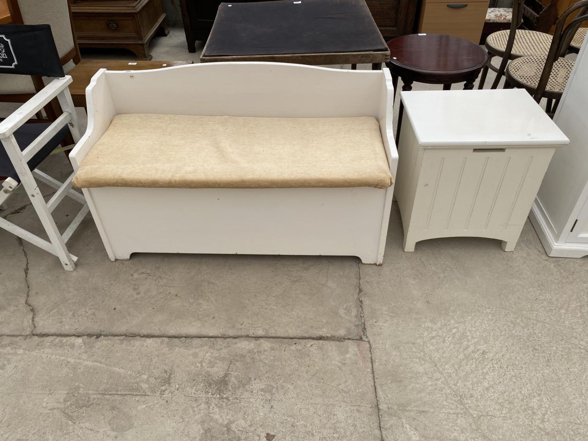 A WHITE BEDROOM SEAT WITH STORAGE COMPARTMENT AND A WHITE LINEN BOX