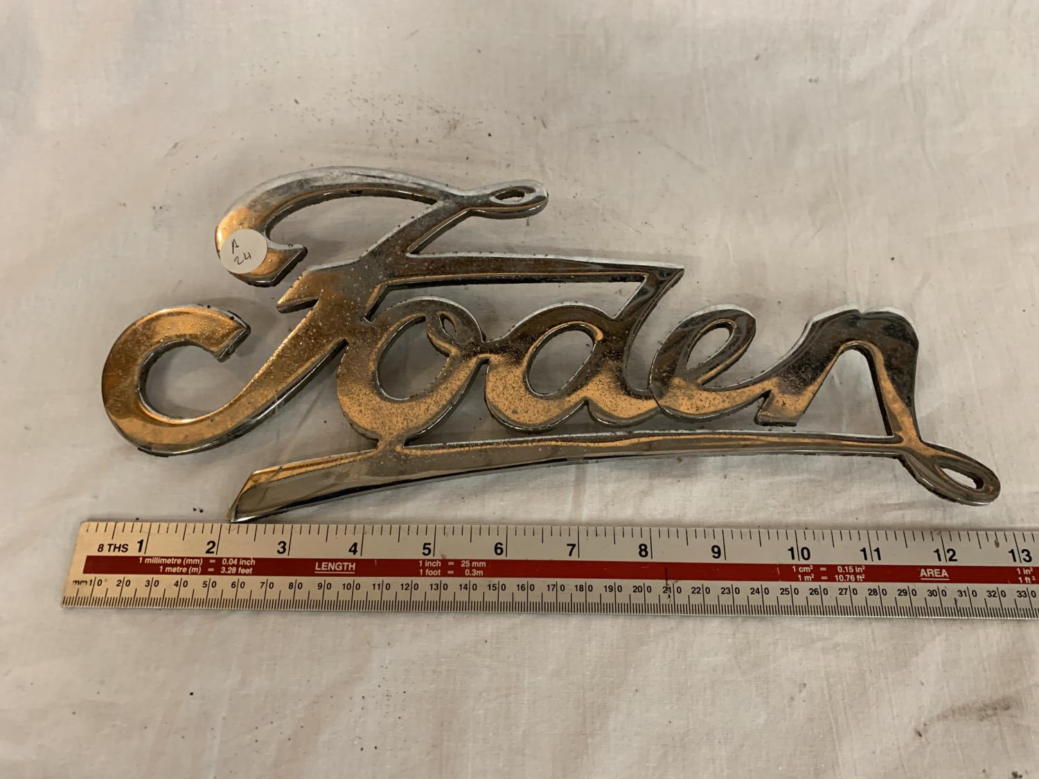 A METAL FODEN BADGE APPROXIMATELY 33CM LONG