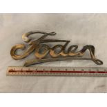 A METAL FODEN BADGE APPROXIMATELY 33CM LONG