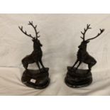 A PAIR OF IMPRESSIVE BRONZE STAGS ON MARBLE BASES