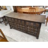 A YOUNGER TOLEDO OAK SIDEBOARD WITH THREE DOORS AND THREE DRAWERS