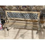 A WOODEN GARDEN BENCH WITH CAST IRON BENCH ENDS AND LATTICE BACK