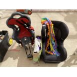 A CHILDS CAR SEAT, BIKE SEAT AND A FUN BOUNCY CASTLE