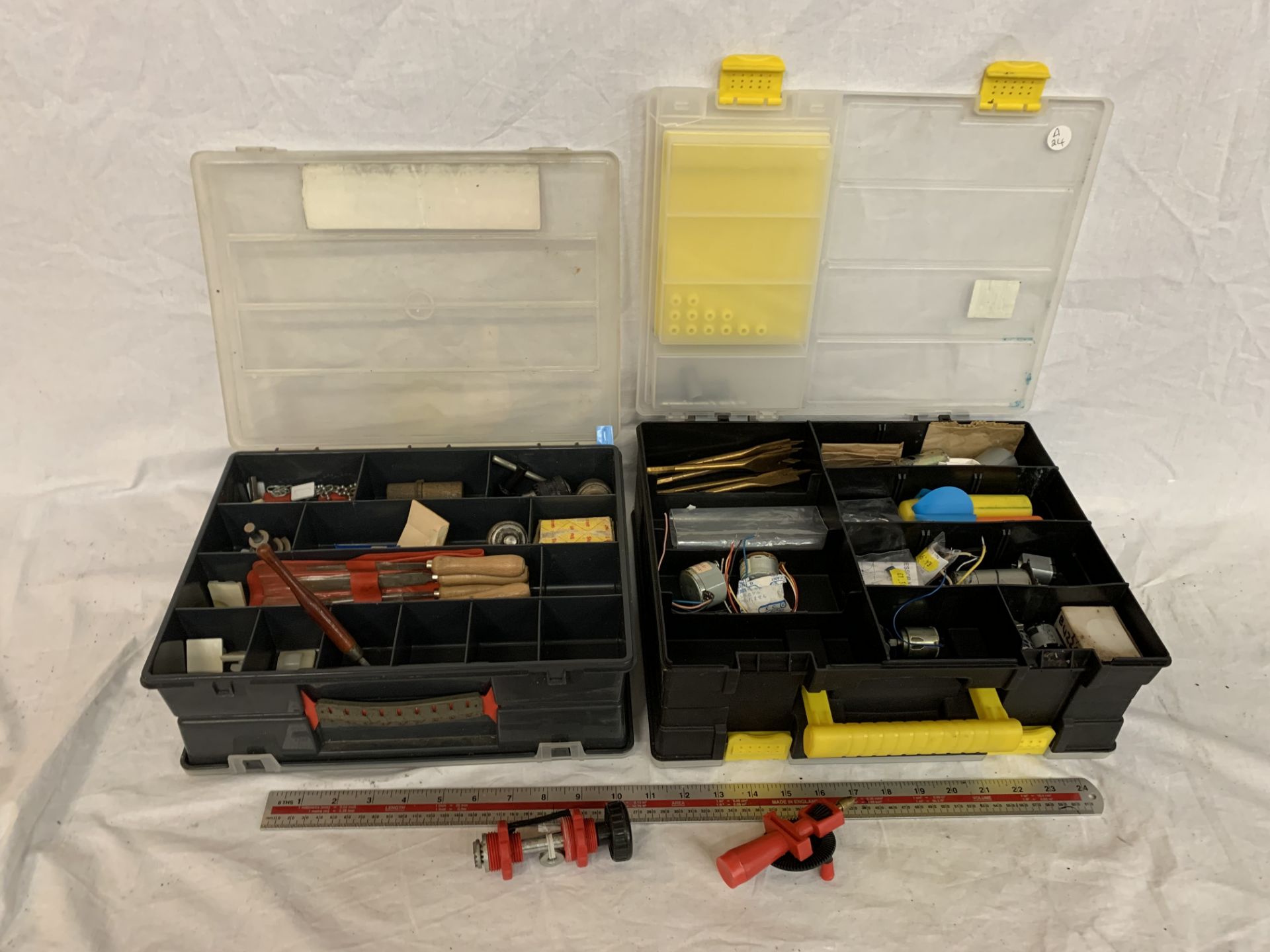 TWO DOUBLE SIDED PLASTIC TOOL BOXES PACKED WITH MODEL MAKING EQUIPTMENT TO INCLUDE BOAT MODEL SPARES