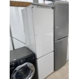 AN UPRIGHT FRIDGE FREEZER - NO PLUG ATTACHED NOT TESTED.