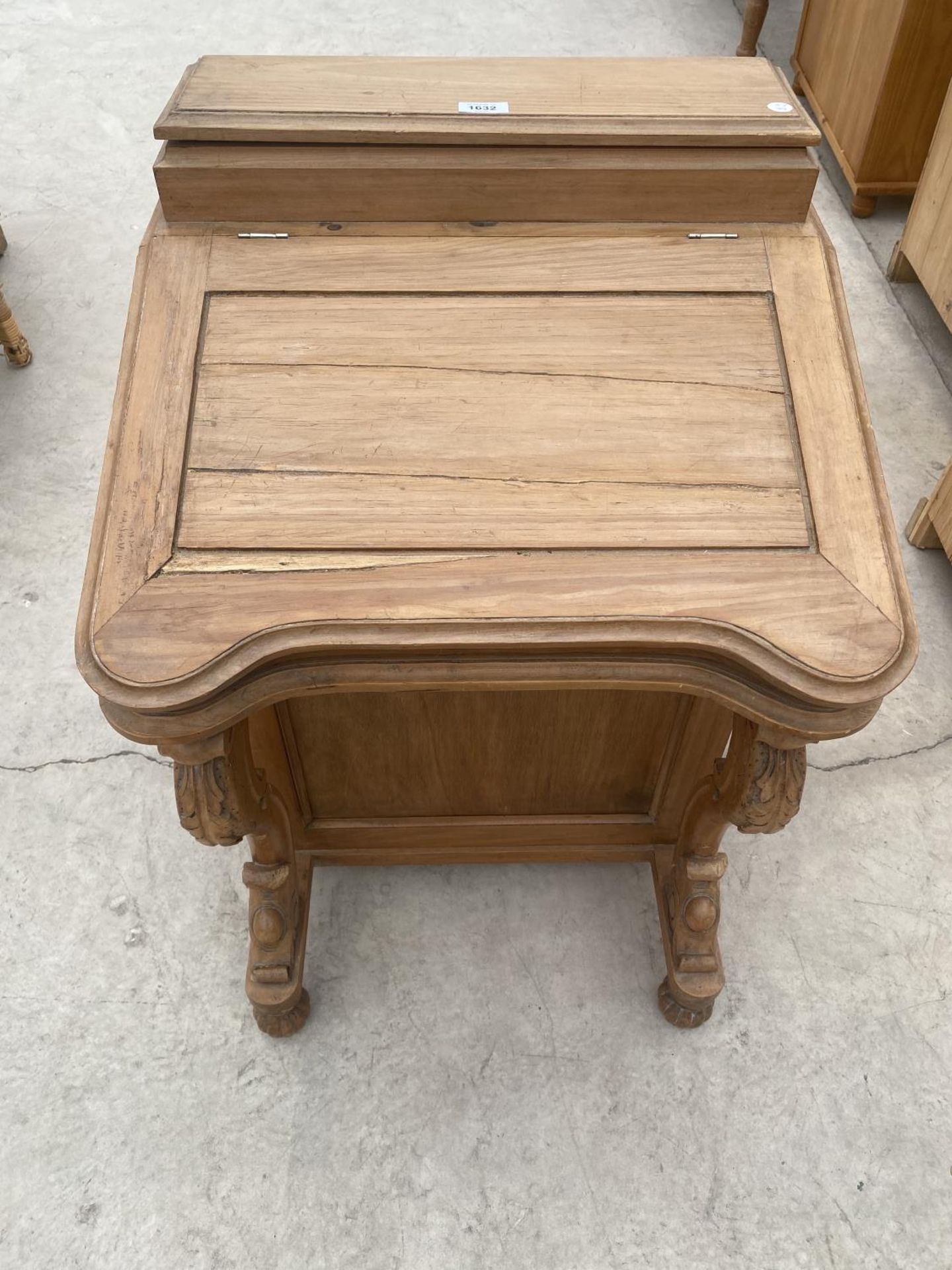 A PINE DAVENPORT WITH HINGED TOP, INKWELL AND FOUR SIDE DRAWERS