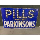 A VINTAGE 'PILLS MADE BY PARKINSONS' SIGN RECOVERED FROM THE RIVER WEAVER AT NANTWICH OVER 40