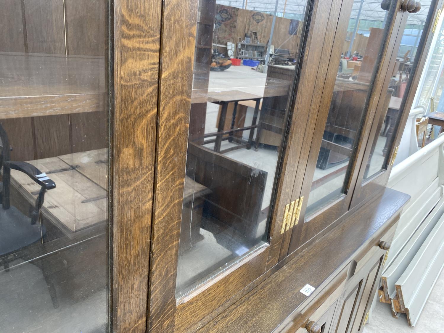 A LARGE SOLID OAK CABINET WITH THREE LOWER DOORS AND DRAWERS AND FOUR UPPER GLAZED DOORS - Image 3 of 5