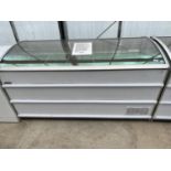 A LARGE SHOP CHEST FREEZER WITH BASKETS REGULARLY MAINTAINED AND IN CLEAN AND WORKING ORDER