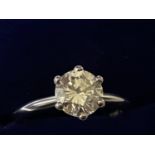 A 1.54 CARAT DIAMOND AND 18 CARAT WHITE GOLD RING. COLOUR K, CLARITY VS2, RING SIZE M