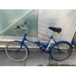 A VINTAGE TRIUMPH FOLDING BICYCLE WITH THREE GEARS