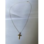 A 9 CARAT GOLD CRUCIFIX PENDANT AND NECKLACE CHAIN. WEIGHT 1.4 GRAMS. CHAIN 40 CM