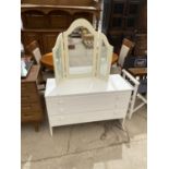 A WHITE CHEST OF THREE DRAWERS AND A THREE SECTION DRESSING MIRROR