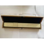 A SLIDE RULE IN WOODEN PRESENTATION BOX