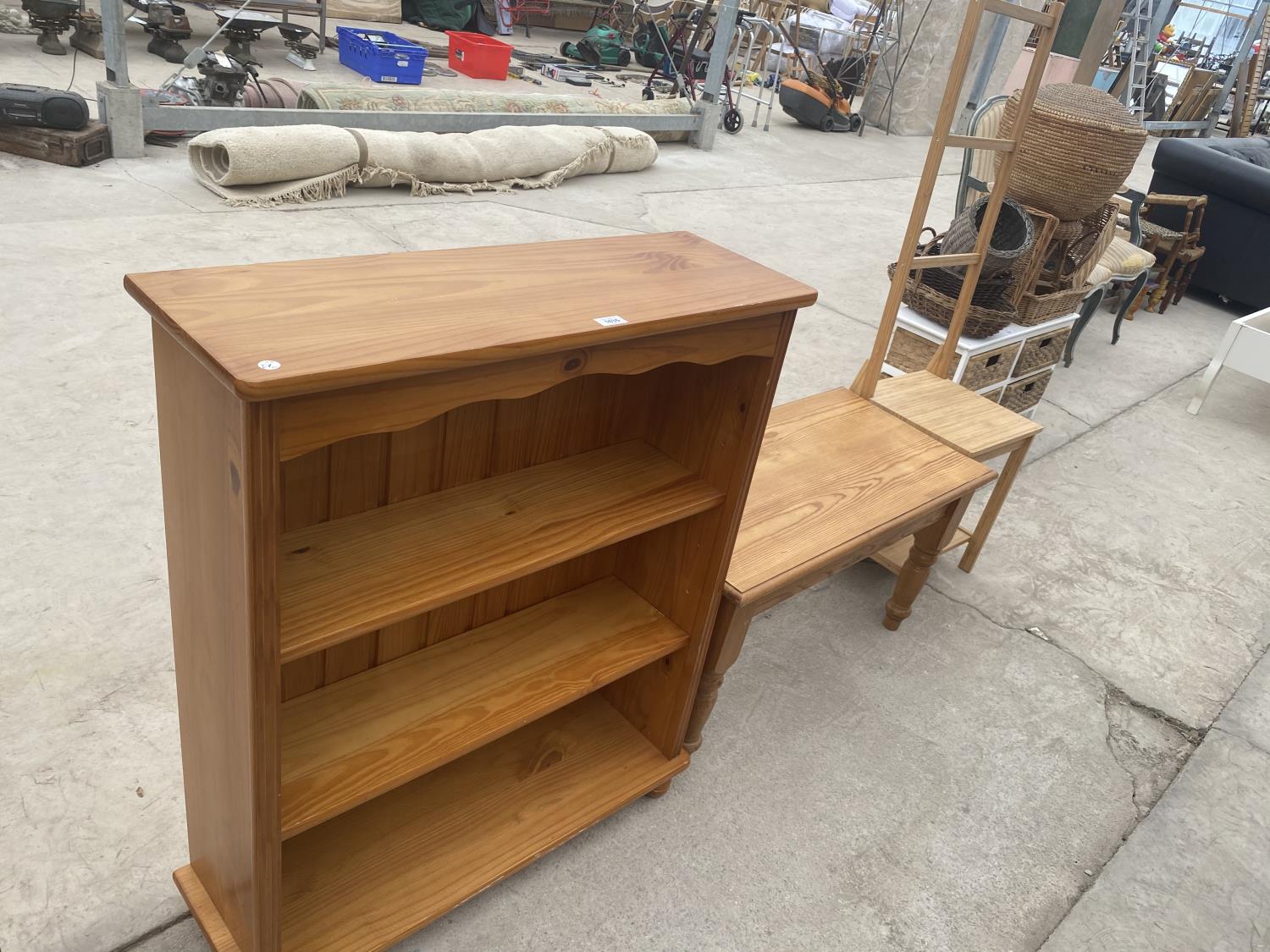 THREE PINE ITEMS - A THREE TIER BOOKSHELF, S COFFEE TABLE AND A HIGH BACKED CHAIR