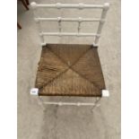 A WHITE PAINTED BOBBIN TURNED CHILD'S CHAIR WITH RUSH SEAT