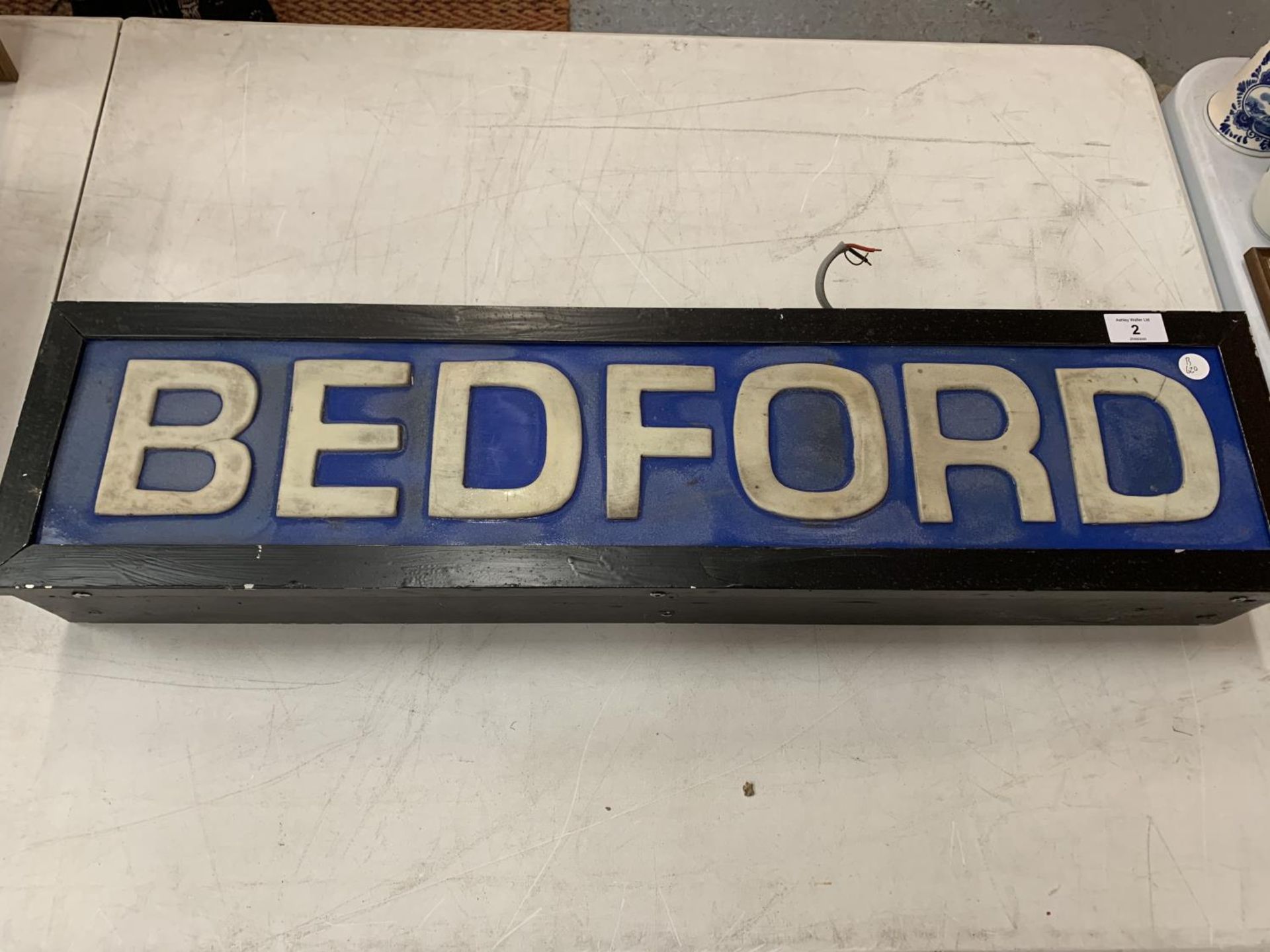 A BEDFORD ILLUMINATED LIGHT BOX SIGN 77CM X 19CM X 10CM