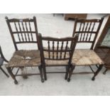 THREE OAK DINING CHAIRS WITH RUSH SEAT (TWO REQUIRE ATTENTION TO SEAT)