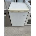 A PROLINE FRIDGE IN NEED OF CLEAN IN WORKING ORDER