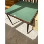 A FOLDING CARD TABLE WITH GREEN BAIZE TOP