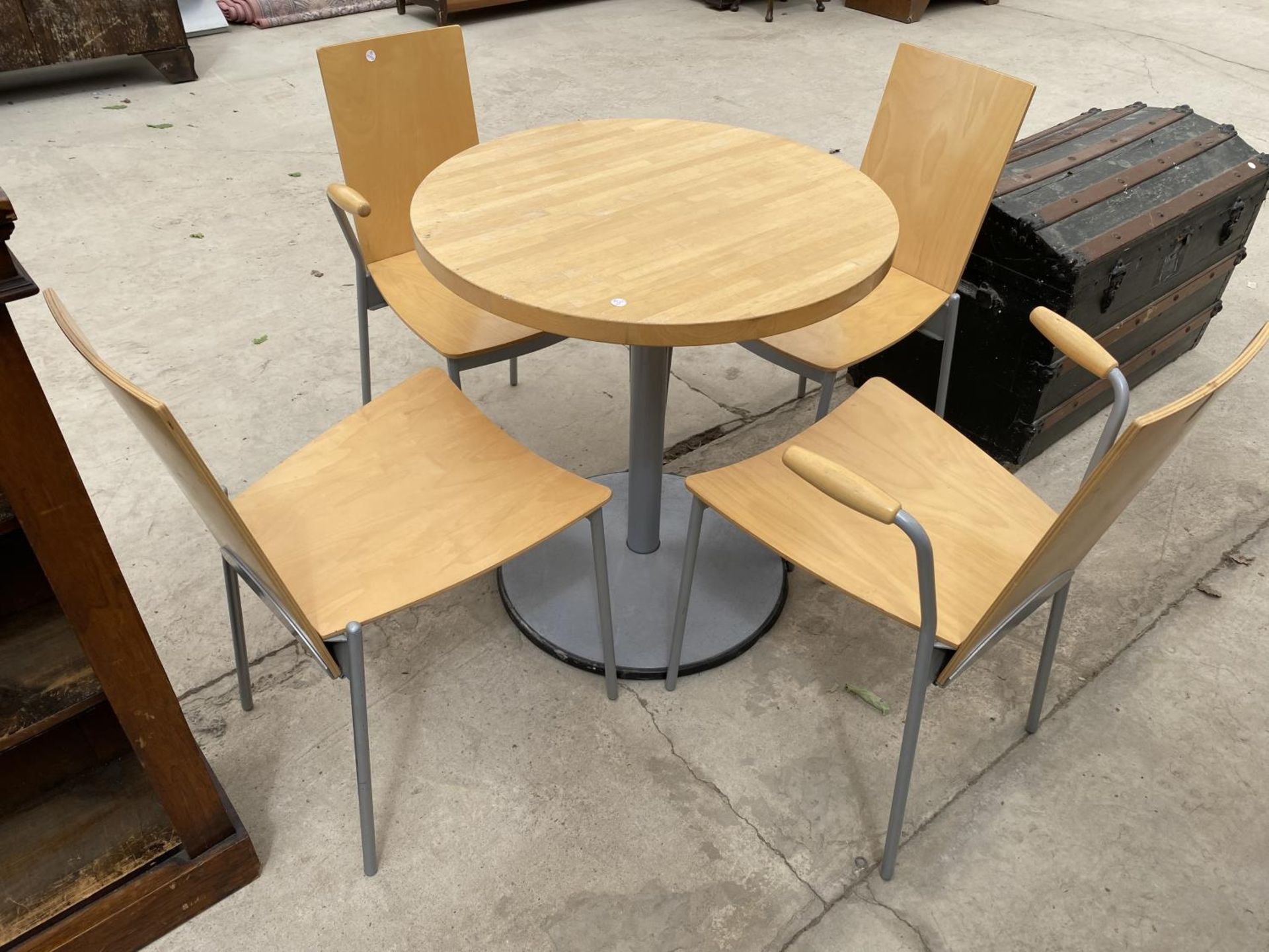 AN IKEA BREAKFAST TABLE AND FOUR CHAIRS