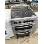 A BEKO COOKER WITH A FOUR RING CERAMIC HOB, GRILL AND OVEN IN NEED OF LIGHT CLEAN