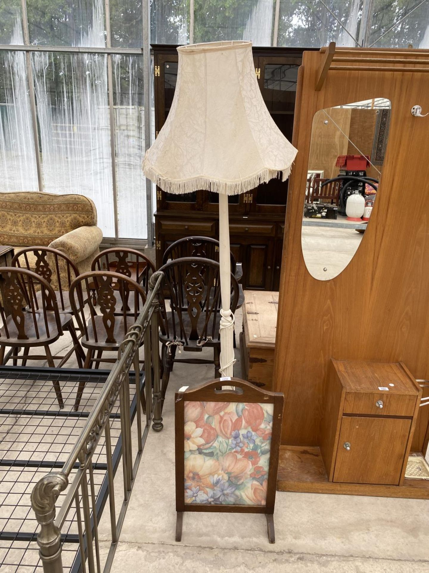 A TAPESTRY FIRESCREEN AND A WHITE STANDARD LAMP